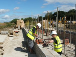 Shows 2 volunteers rebuilding lock 15 on the Grantham Canal. This image is to illustrate the situations vacant page